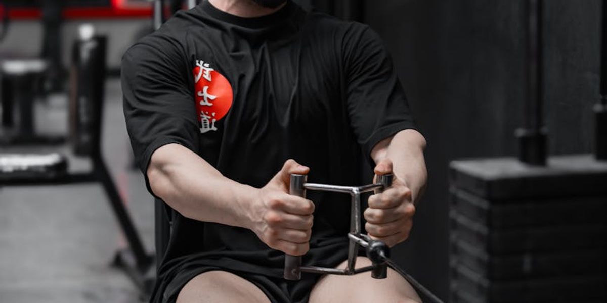 Man focused on a strength training exercise, showing concentration and form.